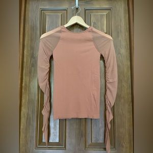 Free People intimately top with sheer mesh sleeves